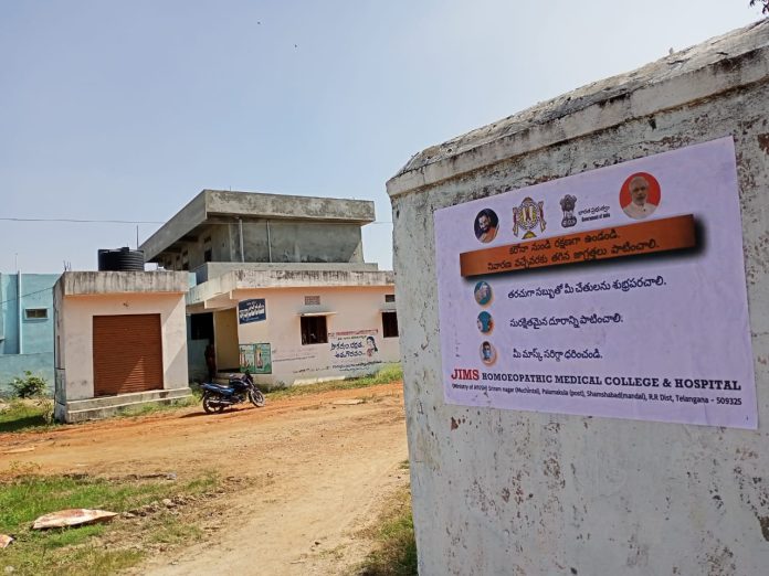 Janandolan Campaign On COVID 19 - IEC Poster Sticking At Narsappaguda Village Of Nandigama Mandal