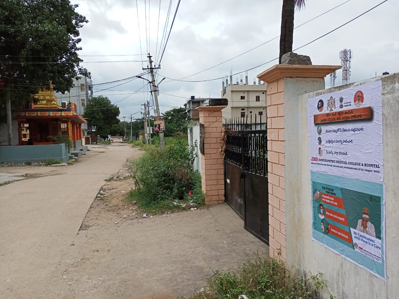 Janandolan Campaign On COVID 19 - IEC Poster Sticking At Rallaguda Of Shamshabad Mandal