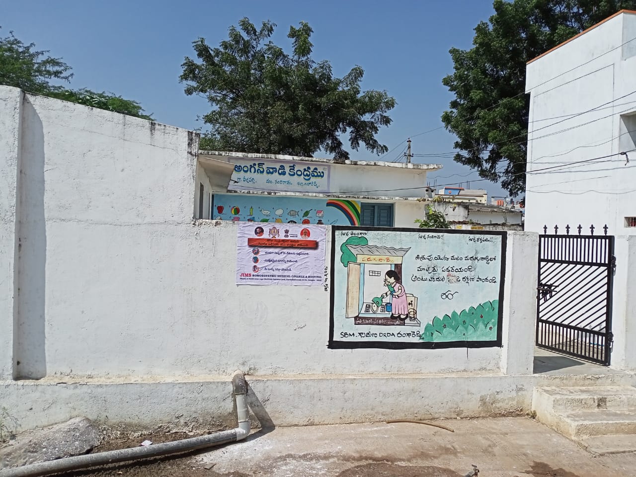 Janandolan Campaign On COVID 19-IEC Poster Sticking At Veerlapally Grama Panchayath